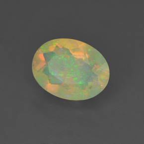 Ópalo multicolor natural de 0,88 ct, corte óvalo, transparente