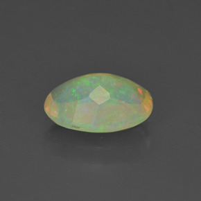 Ópalo multicolor natural de 0,88 ct, corte óvalo, transparente
