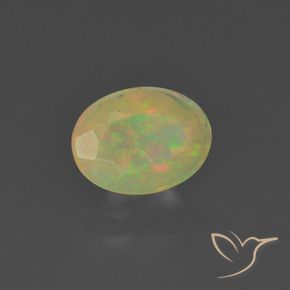 Ópalo Multicolor natural de 0.73 ct, Ovalada, Translúcido