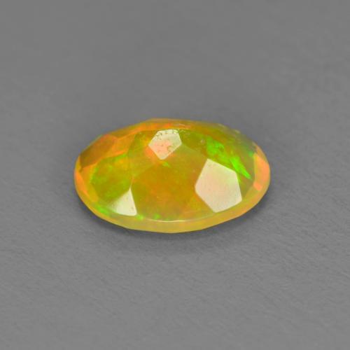 Ópalo multicolor natural de 0,74 ct, corte óvalo, translúcido