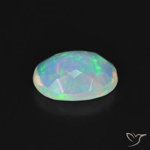 Ópalo Multicolor natural de 0.99 ct, Ovalada, Transparente