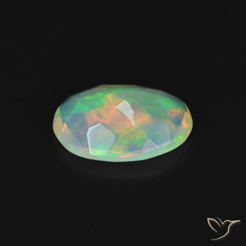 Ópalo Multicolor natural de 0.84 ct, Ovalada, Transparente