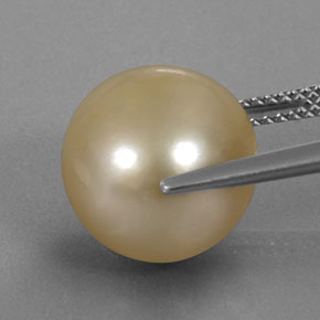 Perla amarillo natural de 12,49 ct, esfera / bola, opaco