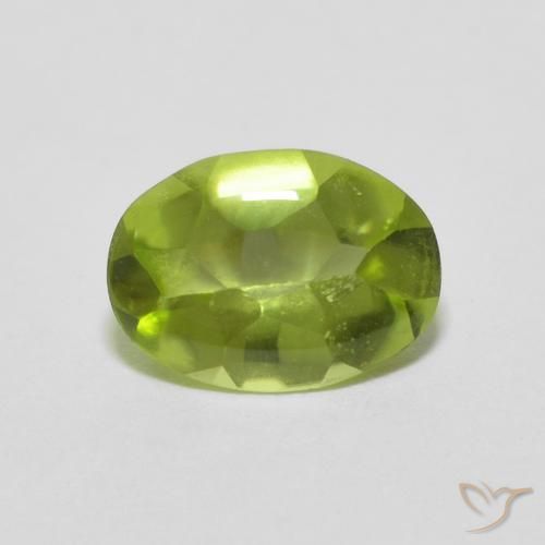 Peridoto Verde vivo natural de 0.78 ct, Ovalada, Transparente