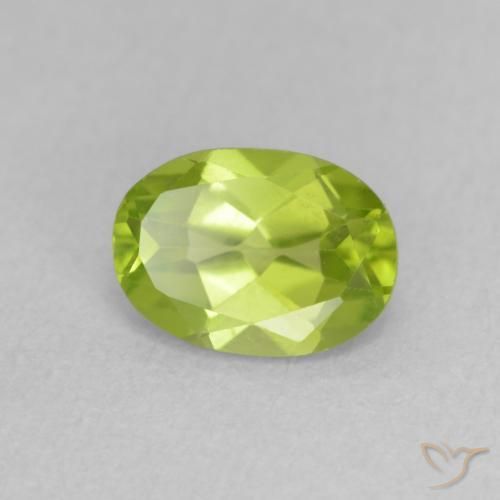 Peridoto Verde vivo natural de 0.88 ct, Ovalada, VS