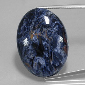 Pietersita multicolor natural de 31,93 ct, corte óvalo, opaco