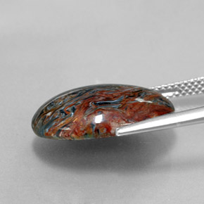Pietersita multicolor natural de 6,85 ct, corte óvalo, opaco