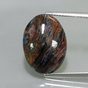 Pietersita multicolor natural de 7,82 ct, corte óvalo, opaco