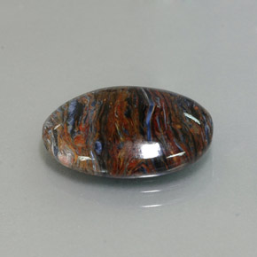 Pietersita multicolor natural de 6,80 ct, corte óvalo, opaco