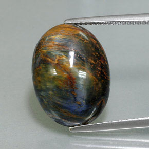 Pietersita multicolor natural de 9,76 ct, corte óvalo, opaco