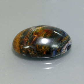 Pietersita multicolor natural de 9,76 ct, corte óvalo, opaco