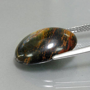 Pietersita multicolor natural de 9,76 ct, corte óvalo, opaco