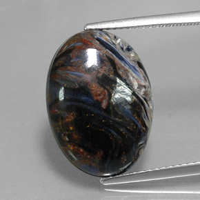 Pietersita multicolor natural de 7,94 ct, corte óvalo, opaco