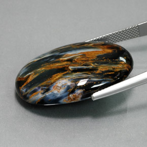 Pietersita azul natural de 32,61 ct, corte óvalo, opaco