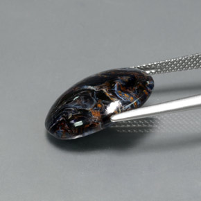 Pietersita multicolor natural de 7,09 ct, corte óvalo, opaco