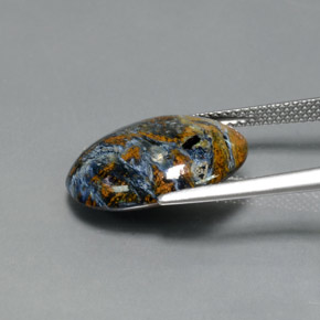 Pietersita multicolor natural de 7,33 ct, corte óvalo, opaco