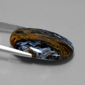 Pietersita multicolor natural de 28,85 ct, corte óvalo, opaco