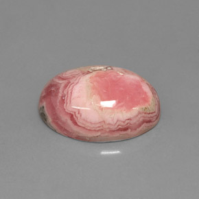 Rodocrosita multicolor natural de 7,08 ct, corte óvalo, opaco