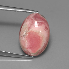 Rodocrosita multicolor natural de 7,08 ct, corte óvalo, opaco