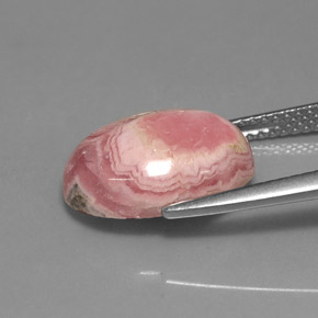 Rodocrosita multicolor natural de 7,08 ct, corte óvalo, opaco