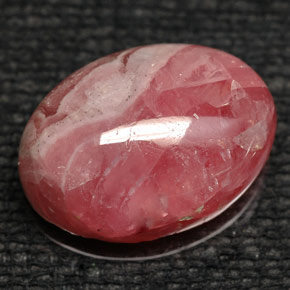 Rodocrosita multicolor natural de 8,43 ct, corte óvalo, opaco