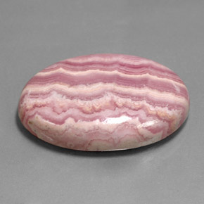 Rodocrosita multicolor natural de 35,26 ct, corte óvalo, opaco