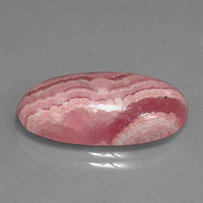 Rodocrosita multicolor natural de 15,90 ct, corte óvalo, opaco
