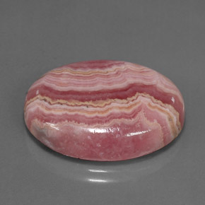 Rodocrosita multicolor natural de 24,57 ct, corte óvalo, opaco