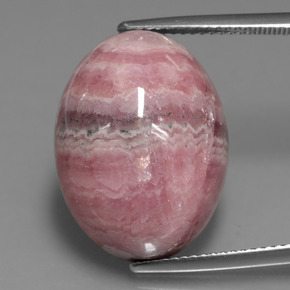 Rodocrosita multicolor natural de 25,74 ct, corte óvalo, opaco
