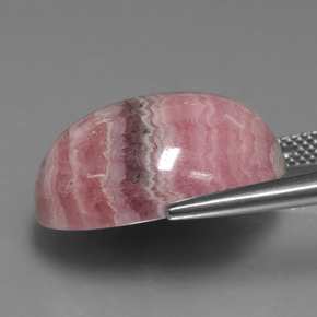 Rodocrosita multicolor natural de 25,74 ct, corte óvalo, opaco