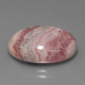 Rodocrosita multicolor natural de 13,41 ct, corte óvalo, opaco