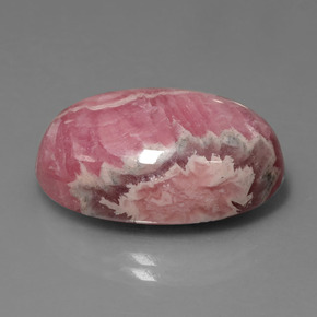 Rodocrosita multicolor natural de 31,54 ct, corte óvalo, opaco