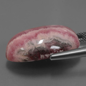 Rodocrosita multicolor natural de 29,62 ct, corte óvalo, opaco