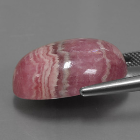 Rodocrosita multicolor natural de 33,91 ct, corte óvalo, opaco