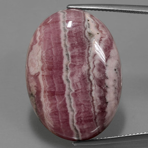 Rodocrosita multicolor natural de 52,06 ct, corte óvalo, opaco