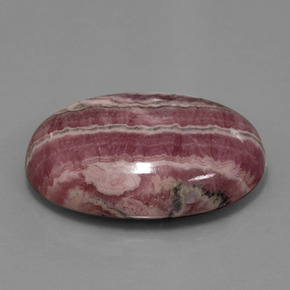 Rodocrosita multicolor natural de 52,06 ct, corte óvalo, opaco