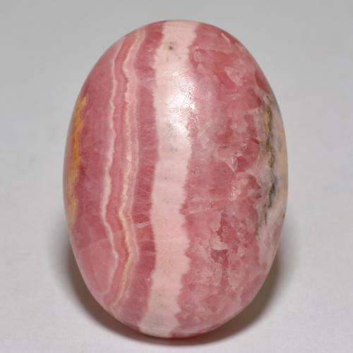 Rodocrosita multicolor natural de 35,96 ct, corte óvalo, opaco