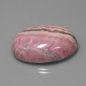 Rodocrosita multicolor natural de 60,57 ct, corte óvalo, opaco