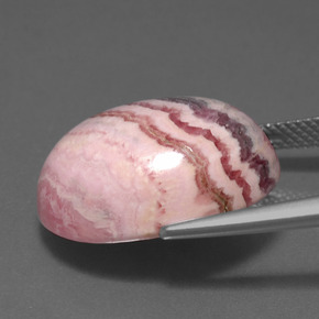 Rodocrosita multicolor natural de 23,72 ct, corte óvalo, opaco