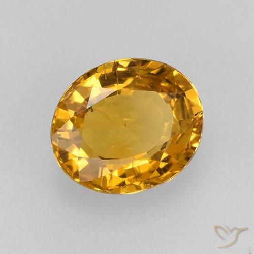 Zafiro Naranja dorado intenso natural de 0.77 ct, Ovalada, VVS-VS