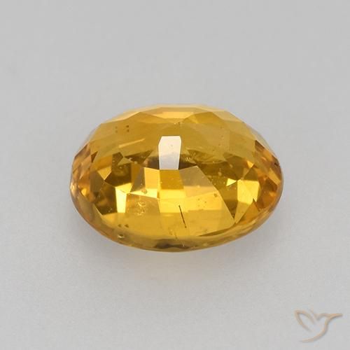 Zafiro Naranja dorado intenso natural de 0.77 ct, Ovalada, VVS-VS