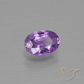 Zafiro Violeta rosado medio natural de 0.54 ct, Ovalada, VS