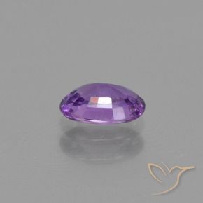 Zafiro Violeta rosado medio natural de 0.54 ct, Ovalada, VS