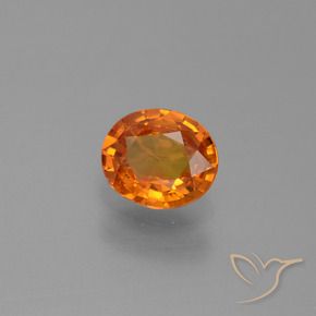 Zafiro Naranja oscuro natural de 0.74 ct, Ovalada, VS