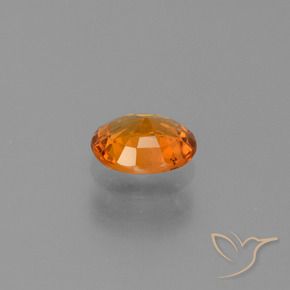 Zafiro Naranja oscuro natural de 0.74 ct, Ovalada, VS