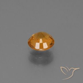 Zafiro Naranja oscuro medio natural de 0.67 ct, Redondo, VS-SI