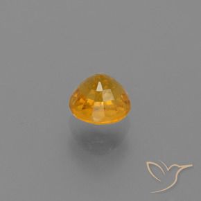 Zafiro Dorado naranja intenso natural de 0.84 ct, Redondo, VS