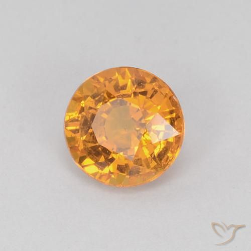 Zafiro Dorado naranja natural de 0.71 ct, Redondo, VS