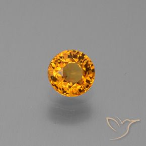 Zafiro Dorado naranja intenso natural de 0.67 ct, Redondo, VS