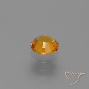Zafiro Dorado naranja intenso natural de 0.67 ct, Redondo, VS
